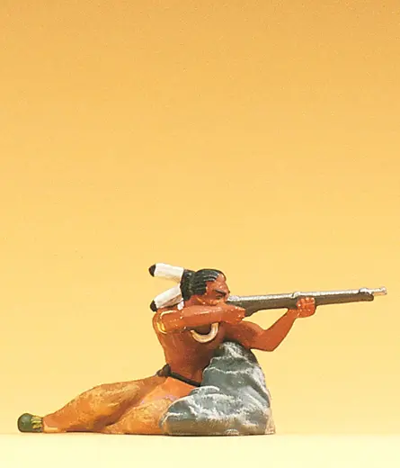 Indianer am Fels liegend mit Gewehr